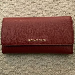 MichaelKors pebbled leather wallet.OXBLOOD/reddish